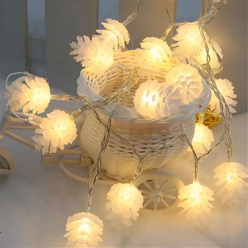 LED pine cone light string with plastic shell housing in warm white colour