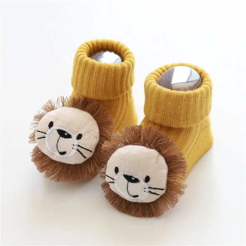 Cotton baby socks in multiple colours and prints including panda, lion, bows, and stars on a white background.
