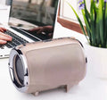 Portable metal subwoofer speaker with buttons in black, blue, gold, red, or silver colours.