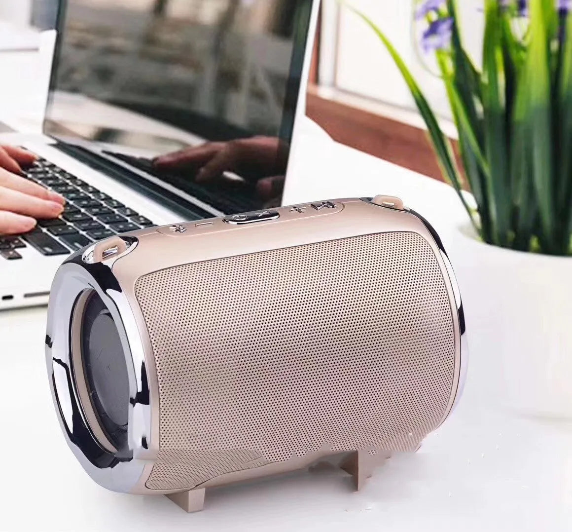 Portable metal subwoofer speaker with buttons in black, blue, gold, red, or silver colours.