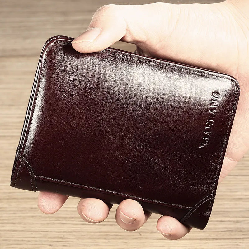 Men's compact leather wallet open showing card slots, change pouch, photo slot, and dark privacy compartment.