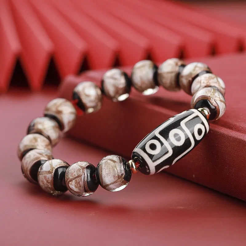 Chinese-style coloured glaze lucky bead bracelet with auspicious patterns for the Year of the Snake.