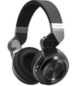 Blue String T2 black and white over-ear Bluetooth headphones showing rotating fold mechanism and 1.5m cable