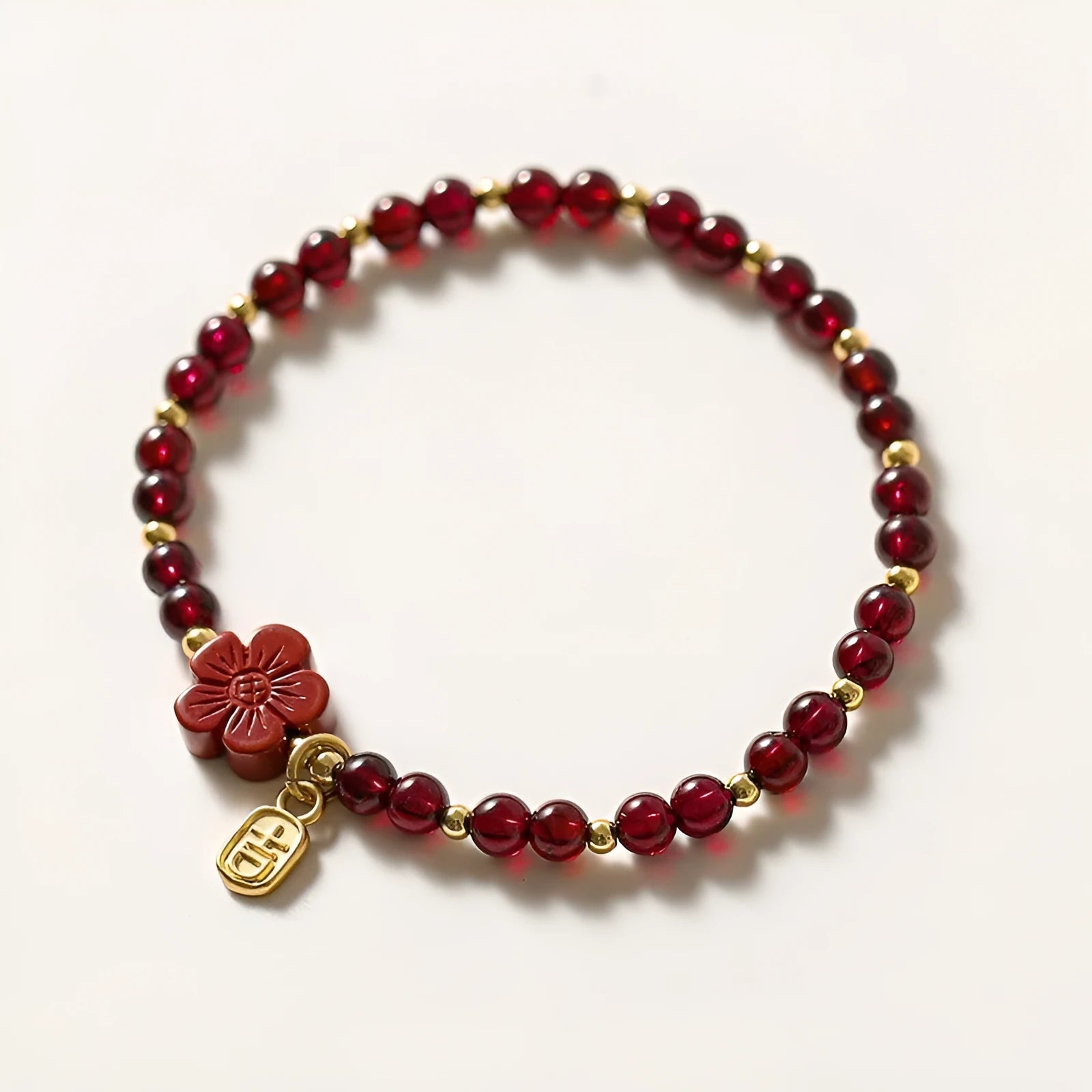 Women's freshwater pearl and geometric crystal bracelet on a stretchy elastic rope.