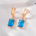 Square geometric earrings with electroplated gold or silver finish on copper, showing quadrilateral design elements