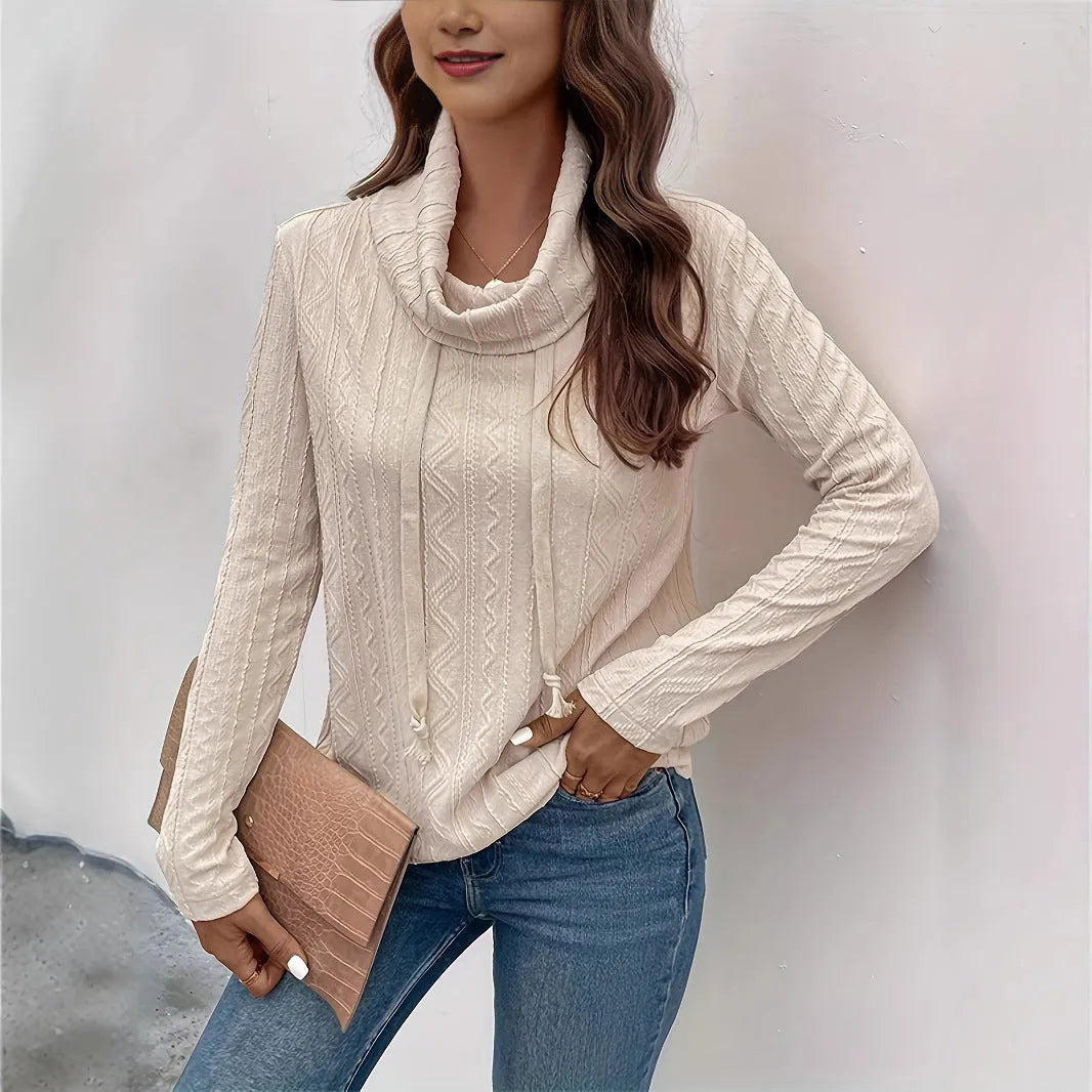 Apricot coloured women's hooded pullover sweater with long sleeves and a front drawstring.