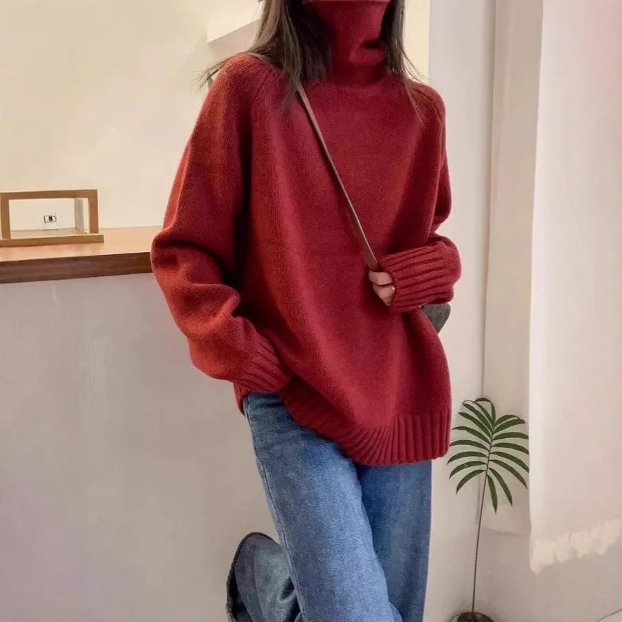 Women's thick loose turtleneck sweater in black with curling pile collar and 3D pattern