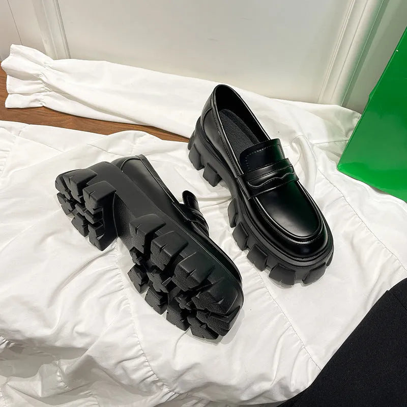 British style wide fit loafers in patent leather with a muffin base heel and rubber sole