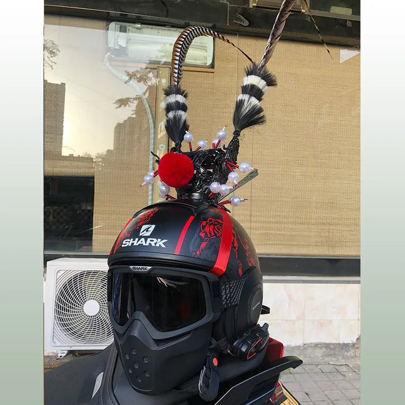Black and gold crown with long feather plume decoration for mounting on a motorcycle helmet.