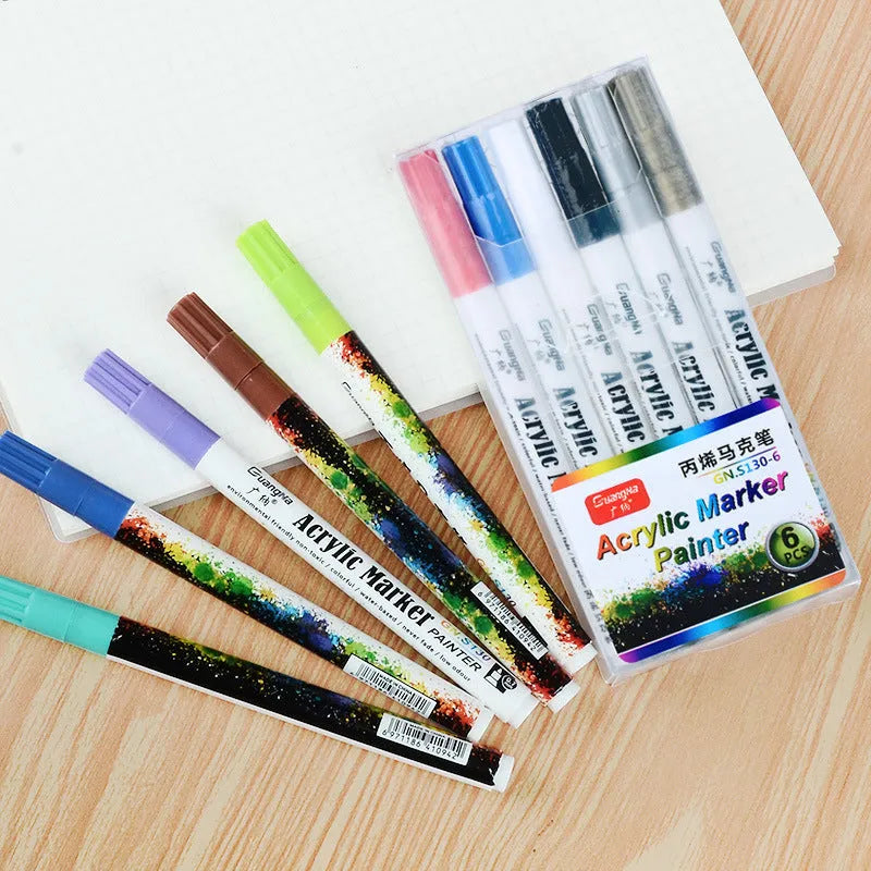 Set of six colourful acrylic graffiti marker pens with 0.7mm tips in plastic packaging