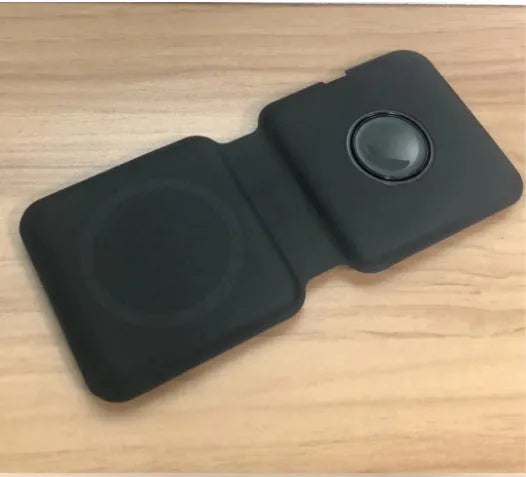 White folding dual magnetic wireless charging dock in stand mode with phone attached