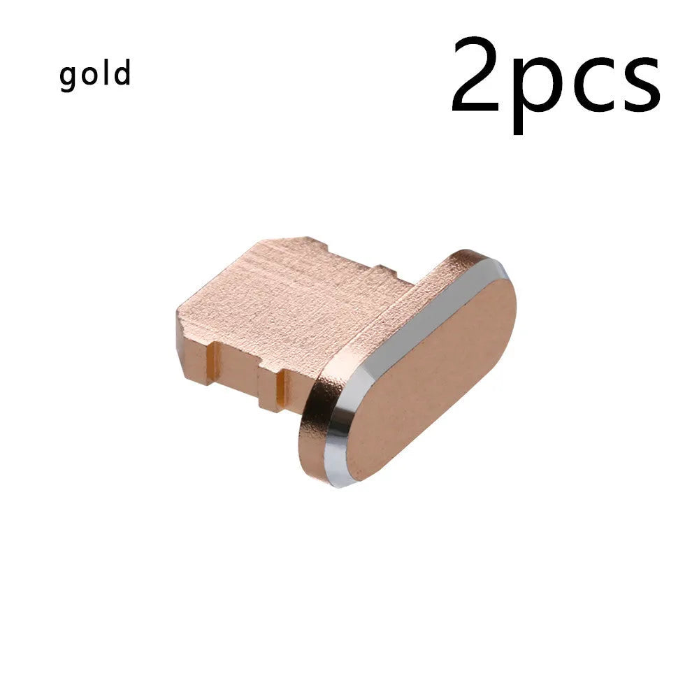 Aluminium alloy dust plug for iPhone charging port in various colours including gold, silver, blue, and rose gold.