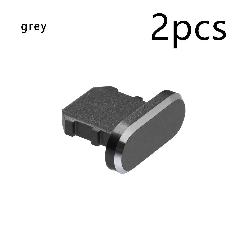Aluminium alloy dust plug for iPhone charging port in various colours including gold, silver, blue, and rose gold.