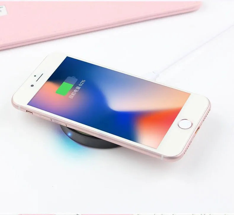 Square Qi wireless charging pad in one of six colours (Black, Blue, Orange, Red, White, Yellow) on a table.