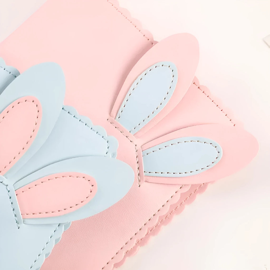 Cute bunny style mini photo album in pink, blue, or white with 16 loose-leaf pages for 3-inch photos.
