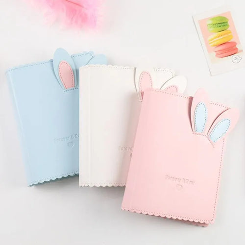 Cute bunny style mini photo album in pink, blue, or white with 16 loose-leaf pages for 3-inch photos.