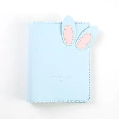 Cute bunny style mini photo album in pink, blue, or white with 16 loose-leaf pages for 3-inch photos.