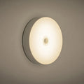 USB rechargeable motion sensor LED night light with 86mm diameter in beige or white