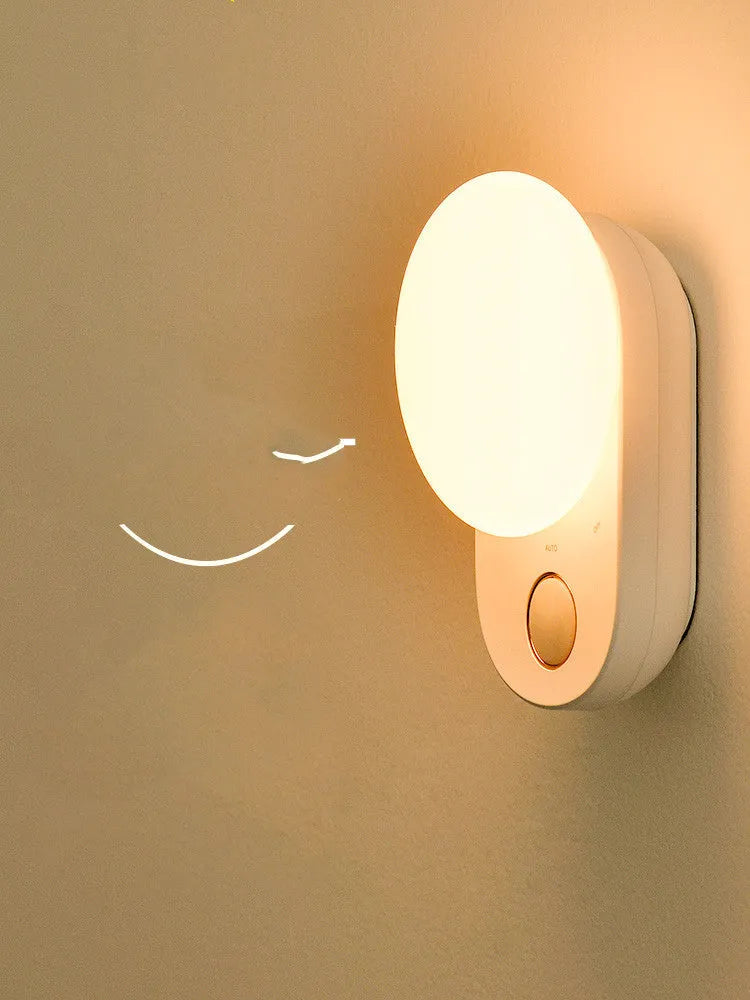 White Baseus rechargeable sensor night light with LED glow, shown on a surface.