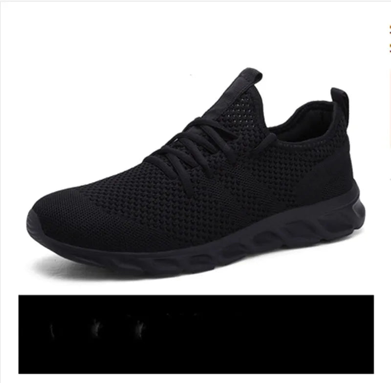 Men's black and white lace-up sport shoes with mesh upper and PVC sole for casual jogging.