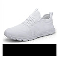 Men's black and white lace-up sport shoes with mesh upper and PVC sole for casual jogging.