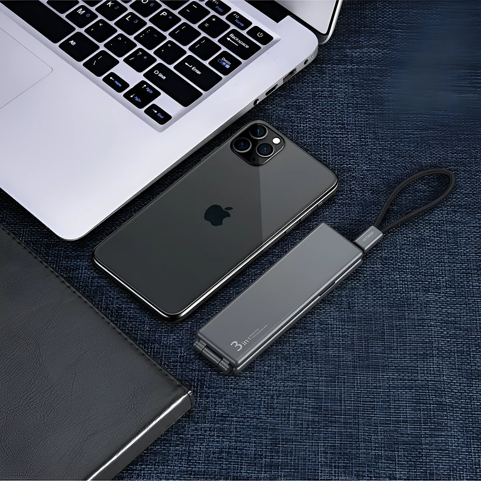 Compact black portable charger with three USB ports for iPhone, Type-C and Micro USB devices