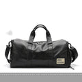 Large black PU leather sports training bag with a shoulder strap, shown with internal organiser pockets for a laptop and camera.