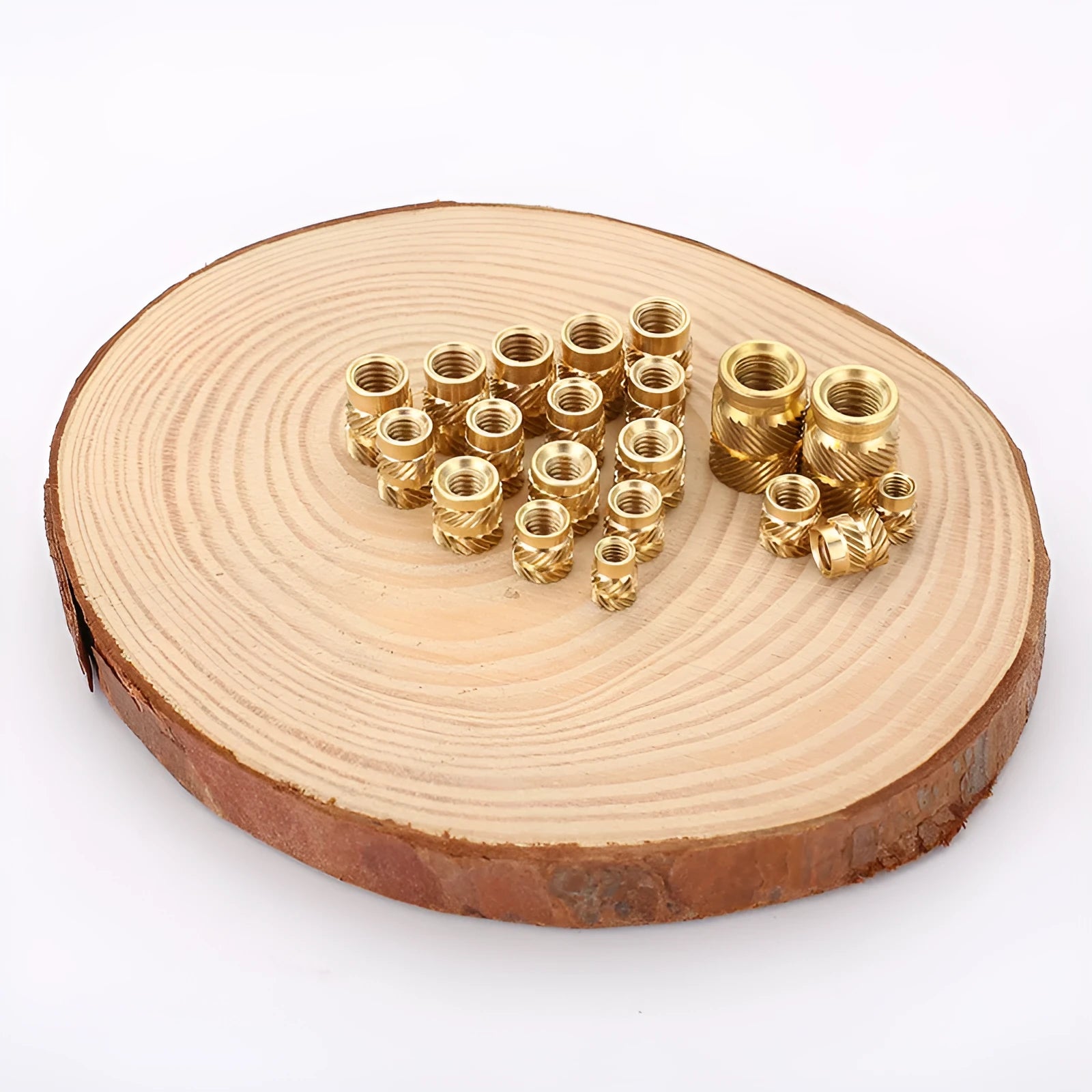 Assortment of brass hot melt copper nuts with M2 and M3 threads in various heights.