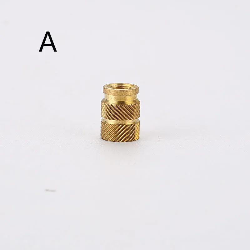 Assortment of brass hot melt copper nuts with M2 and M3 threads in various heights.
