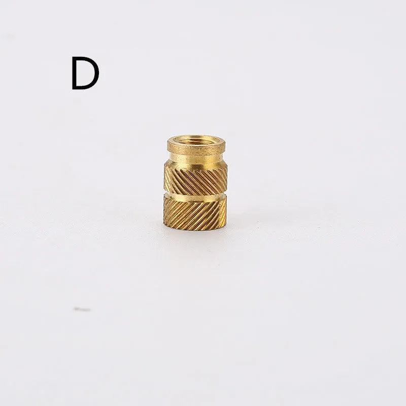Assortment of brass hot melt copper nuts with M2 and M3 threads in various heights.