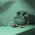 Wireless Bluetooth mini TWS earbuds and charging case in black, white, or green.