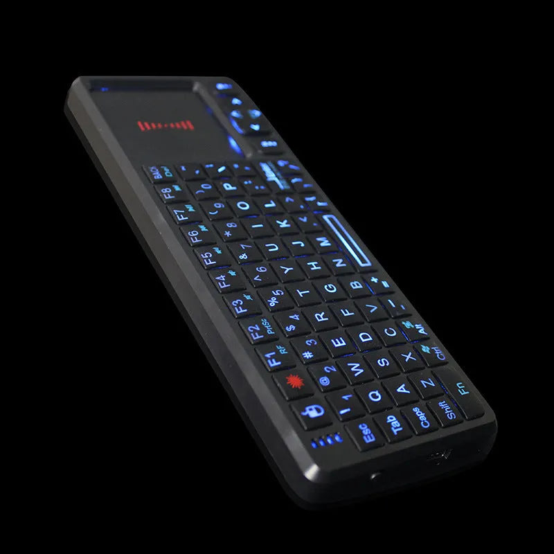 Black wireless mini keyboard with touch screen, showing compact ergonomic design and USB receiver.
