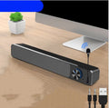 Black and white computer desktop speaker with USB and Bluetooth connectivity options