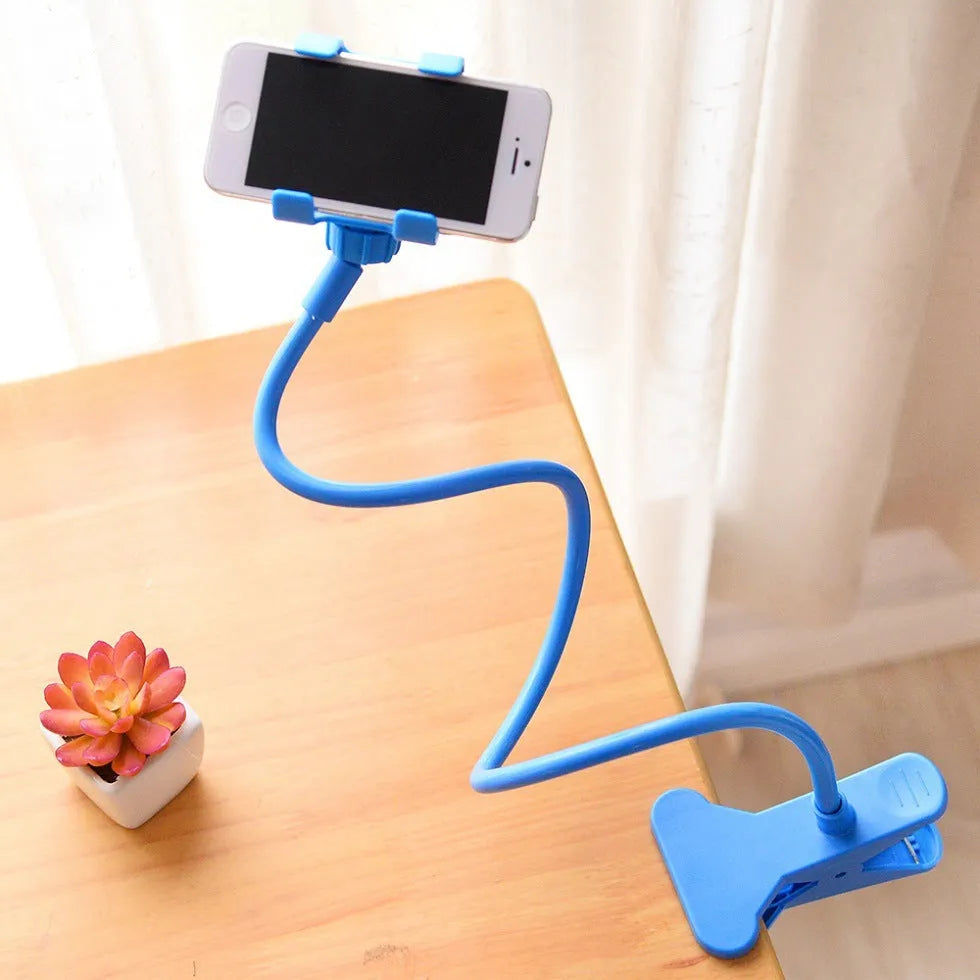 Black universal phone holder with long 70cm flexible arm and V-type clip, mounted on a bed frame.