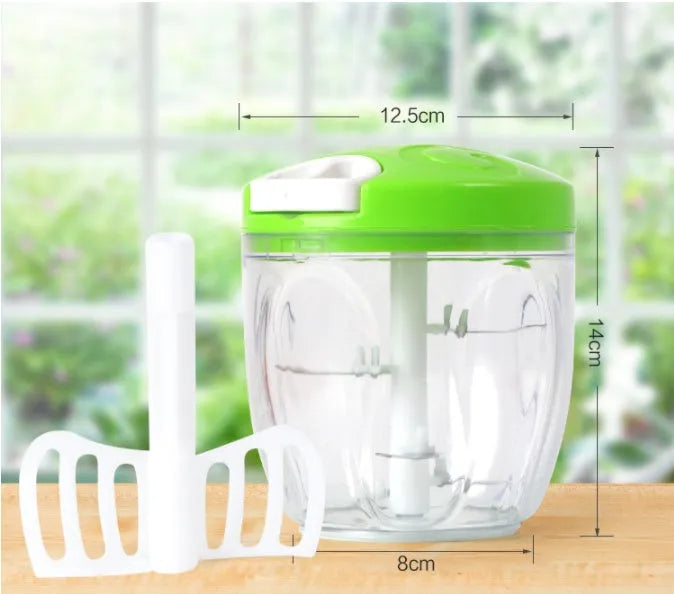 Green manual kitchen chopper with three blades, measuring approximately 13cm long