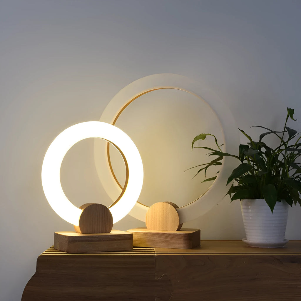 Nordic style wooden circular art chandelier with round acrylic shade in a modern living room.