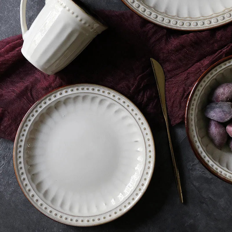 Set of five relief ceramic stoneware plates in retro European design with kiln change relief texture, available in colours C1 to C5