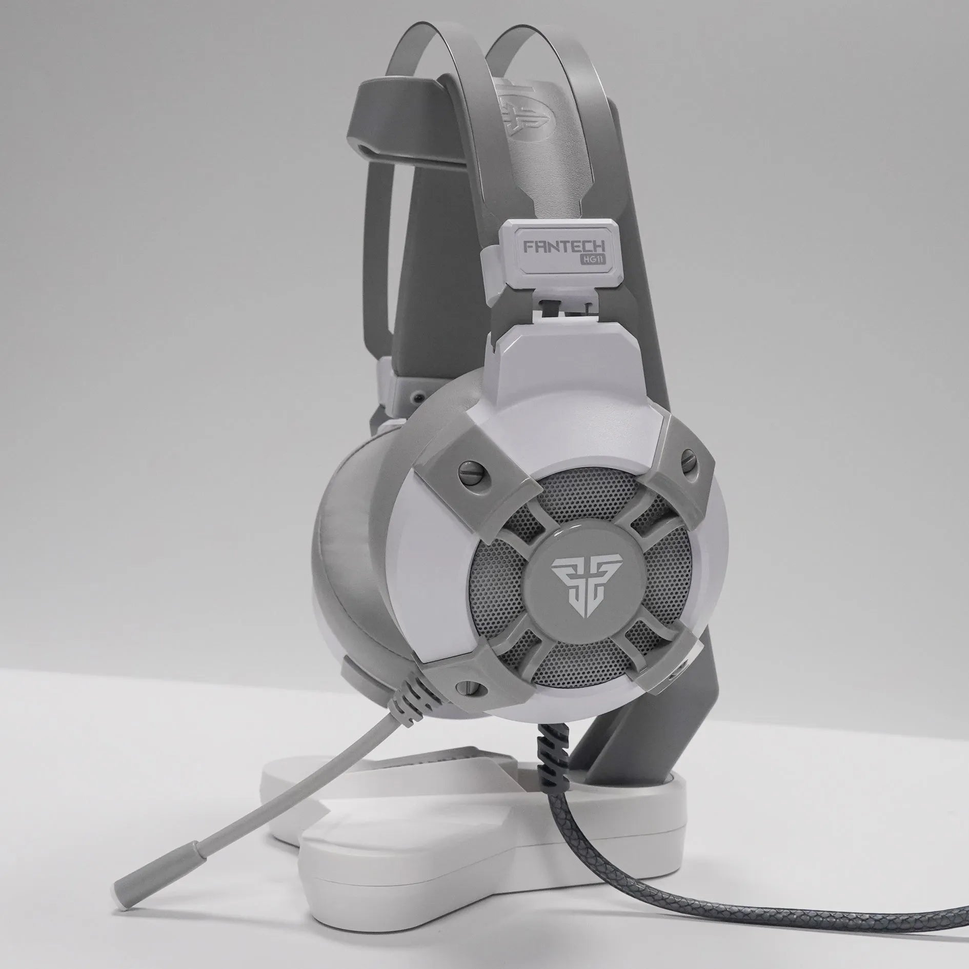 Black Fantech HG11 USB gaming headset with RGB lights and inline remote control on cable.