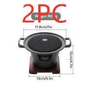Mini BBQ grill alcohol stove with double-head flame and non-stick plate on tabletop