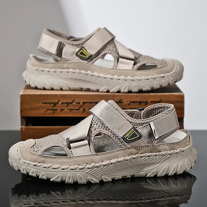 Men's grey genuine leather sandals with mesh lining and an elastic band on a rubber sole.