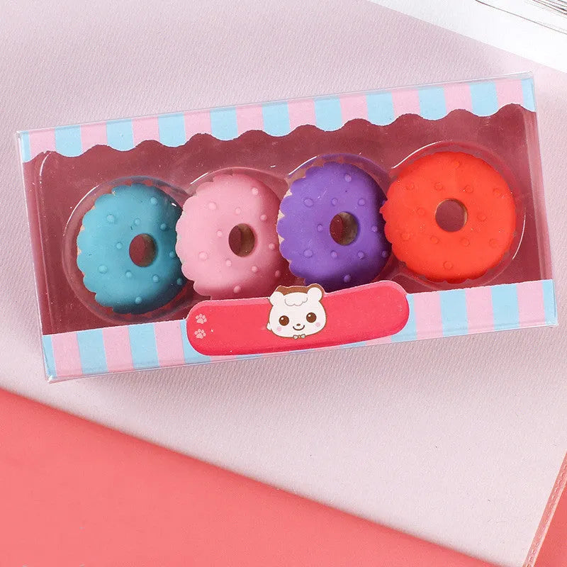 Pack of 12 colourful cartoon erasers shaped like ice cream, donuts, and lollipops for children.