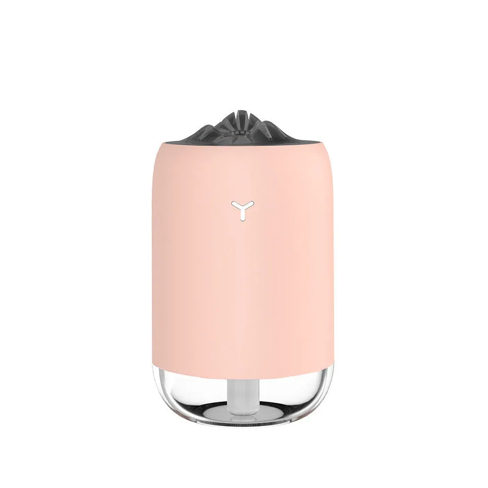 White Magic Flame columnar USB humidifier and aroma diffuser on a desk.