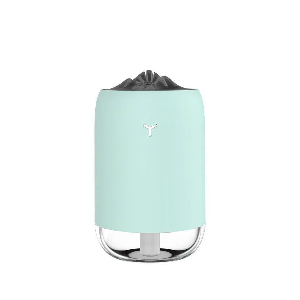 White Magic Flame columnar USB humidifier and aroma diffuser on a desk.