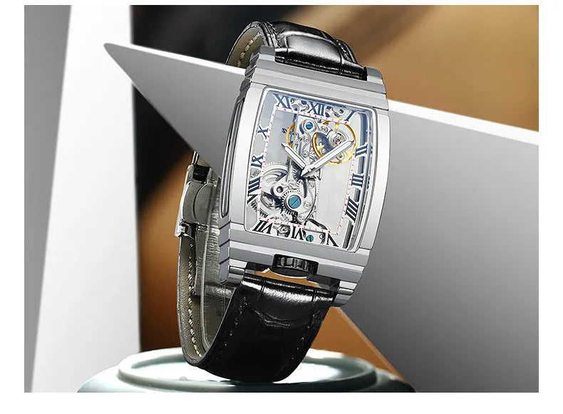 Unisex square stainless steel mechanical watch with leather strap and white dial.