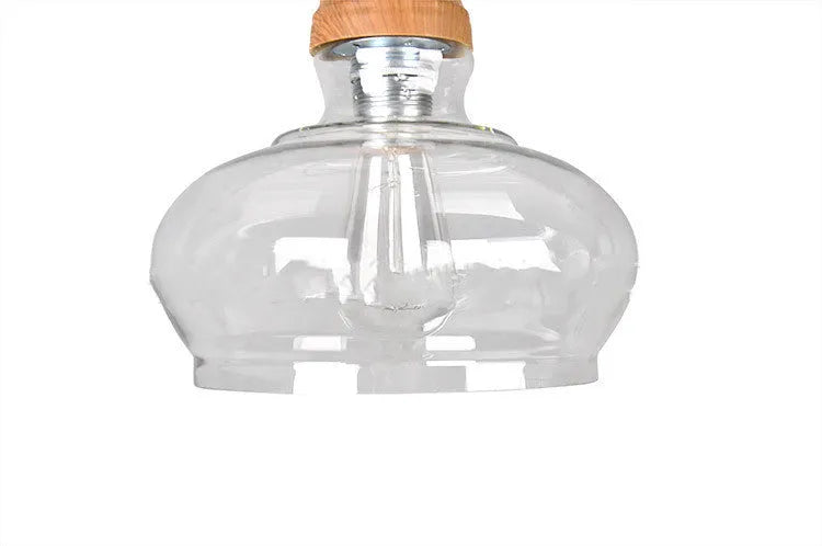 Glass wood grain single head pendant light with adjustable cord in a Nordic style.