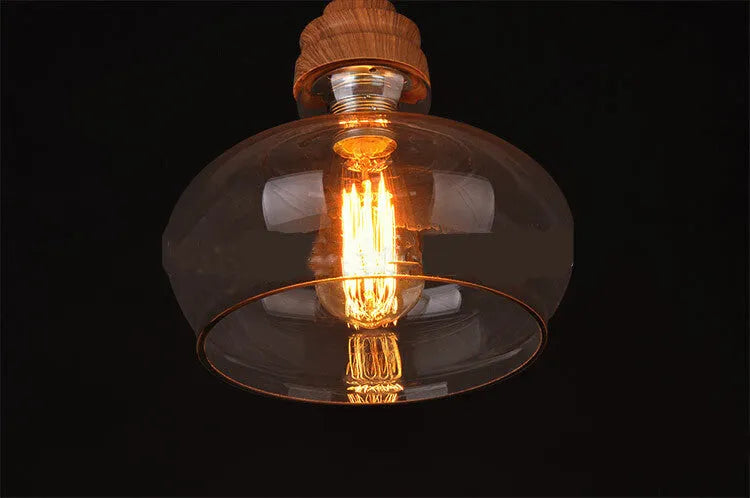Glass wood grain single head pendant light with adjustable cord in a Nordic style.