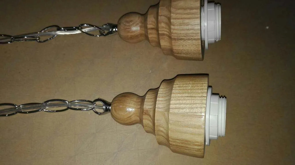 Glass wood grain single head pendant light with adjustable cord in a Nordic style.