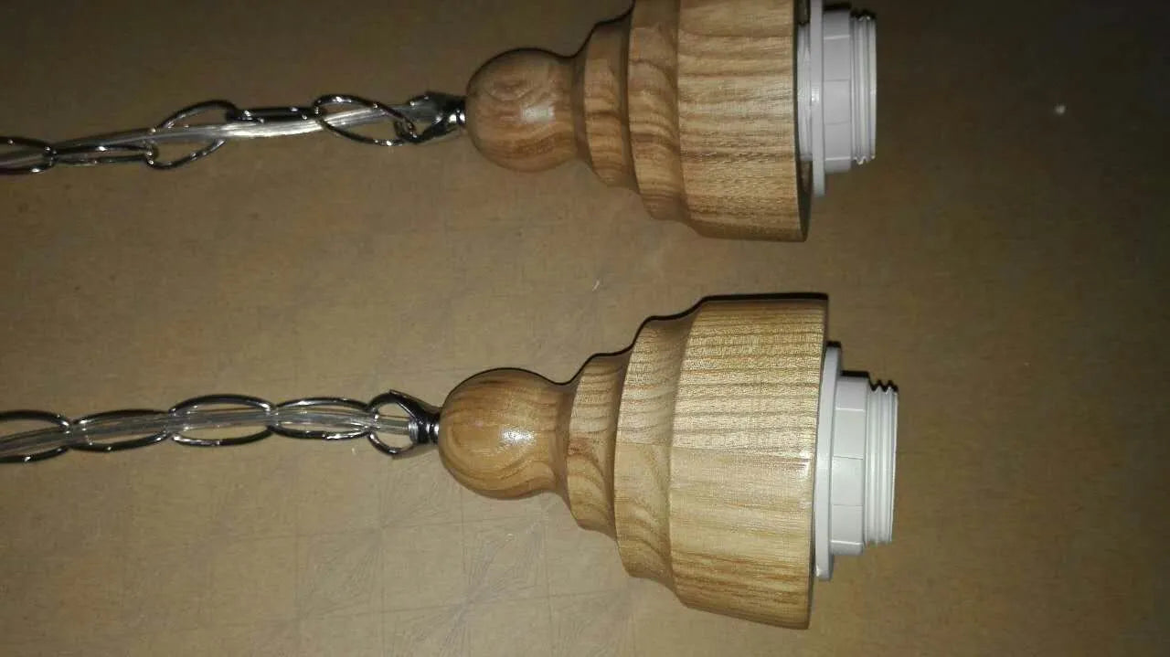 Glass wood grain single head pendant light with adjustable cord in a Nordic style.