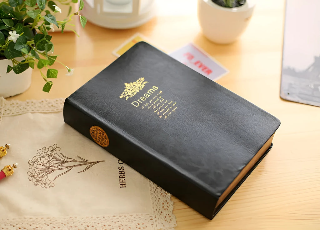 Jingu Super Thick Notebook with imitation leather cover, open showing heavyweight paper and 35mm thickness.