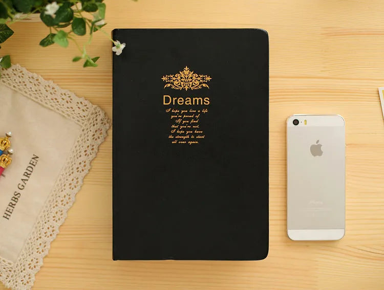 Jingu Super Thick Notebook with imitation leather cover, open showing heavyweight paper and 35mm thickness.